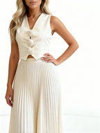 Leandra | Conjunto plisado con chaleco floral y falda midi