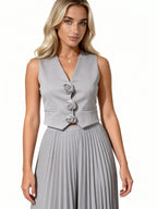 Leandra | Conjunto plisado con chaleco floral y falda midi