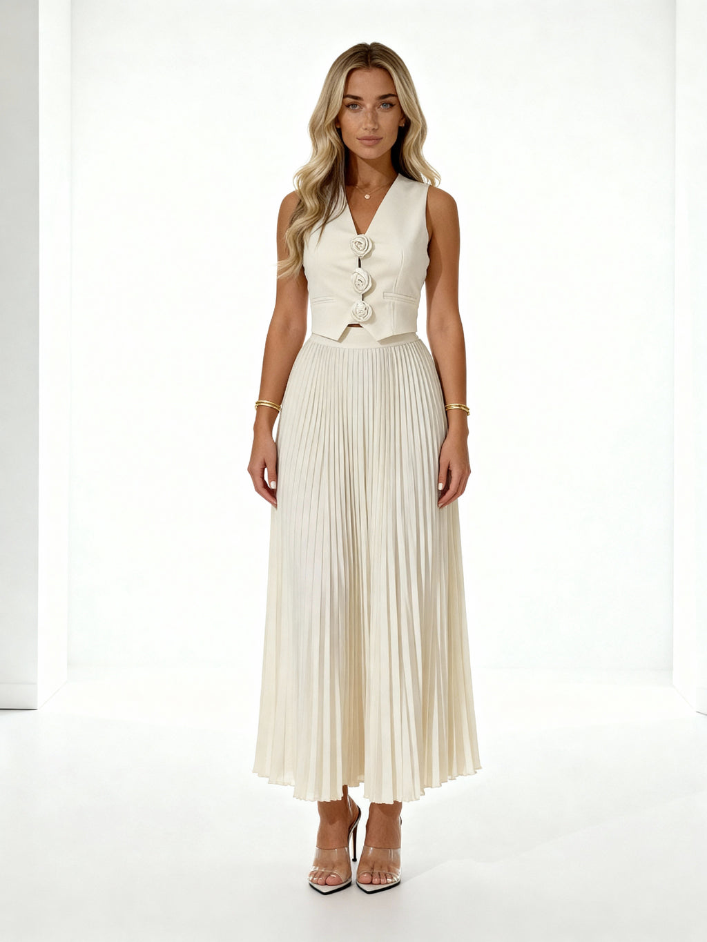 Leandra | Conjunto plisado con chaleco floral y falda midi